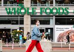 A person walks past a Whole Foods Market in New York on Sept. 29.