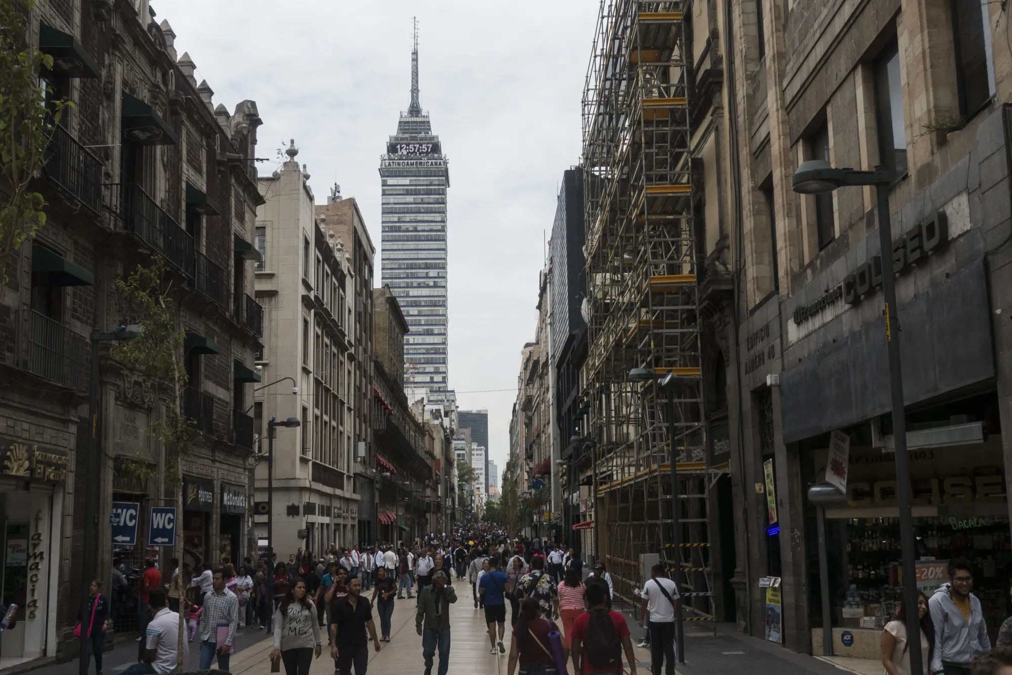Pedestrians pass in front of stores on Francisco I. Madero Avenue in Mexico City.