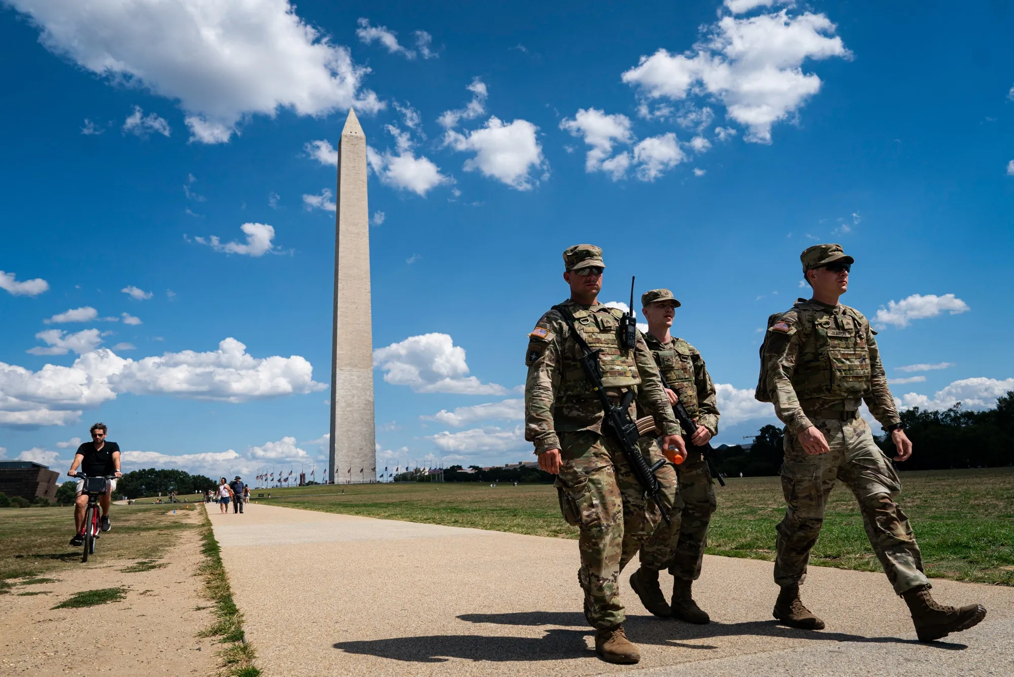 Members of the National Guard patrol near the Washington Monument on the National Mall in Washington, DC, on Thursday, Aug. 28, 2025.&nbsp;