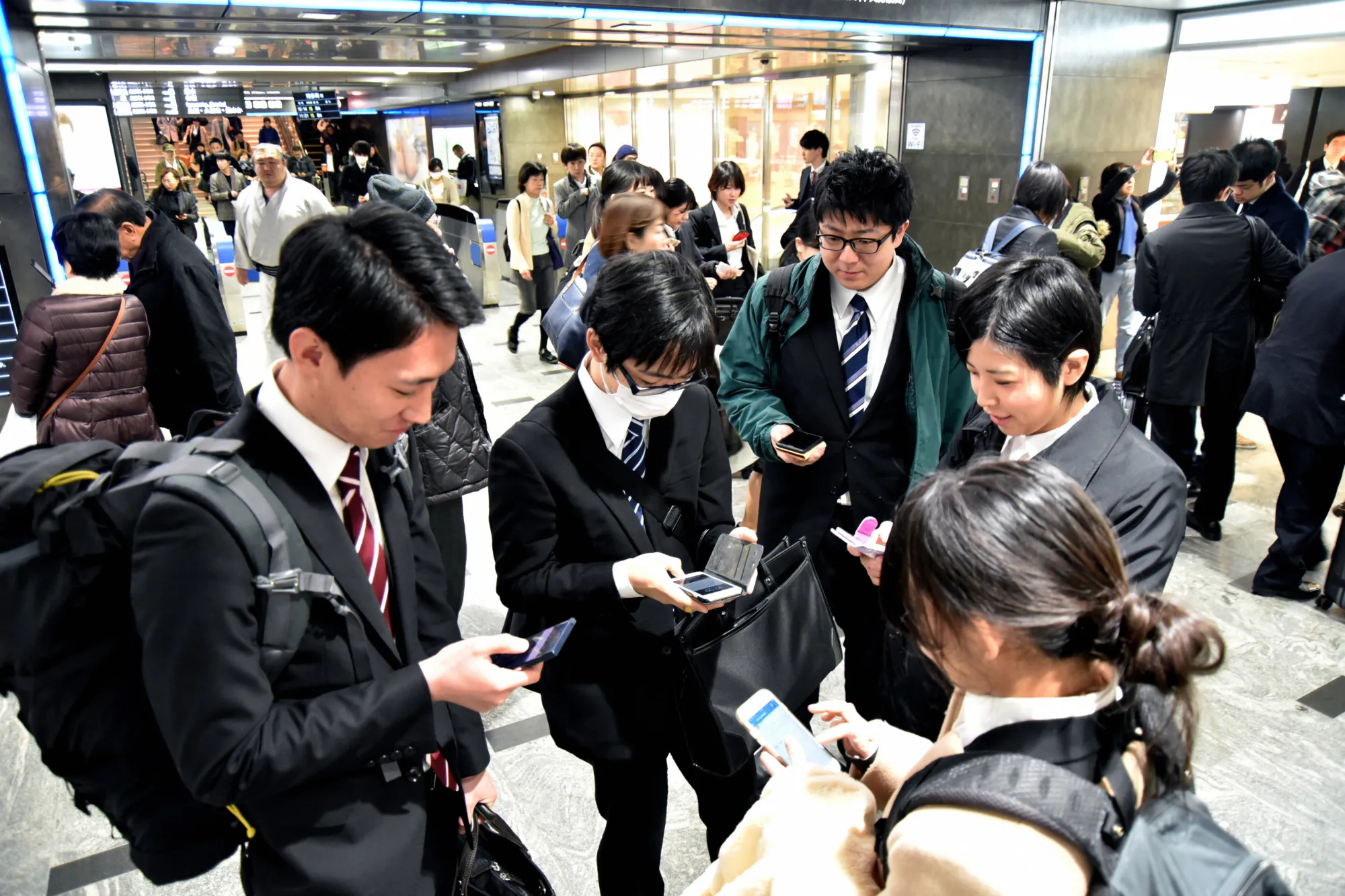 People check their devices during a&nbsp;missile evacuation drill in Fukuoka, in Dec. 2017