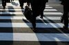 Morning commuters cross a road in the central business district of Tokyo, Japan, on Jan. 4, 2019. Japanese stocks dropped on the first trading day of 2019, as Apple Inc.’s outlook cut and weak economic data from the U.S. and China intensified global growth concerns.