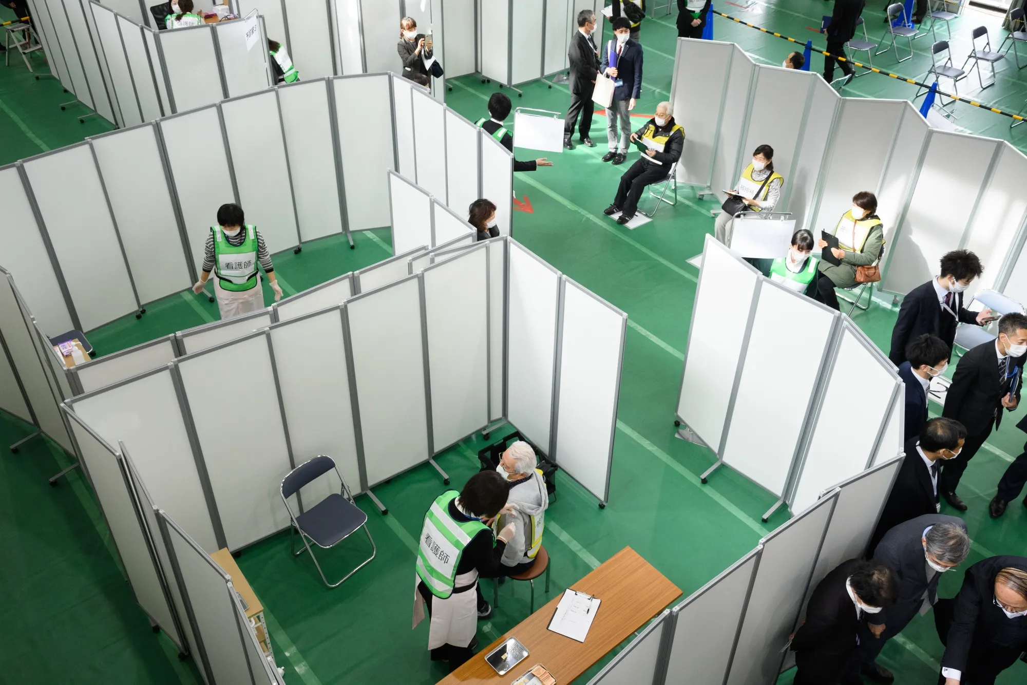 A vaccination simulation takes place at a gymnasium of Kawasaki City College of Nursing in Kawasaki, Japan, on Jan. 27.