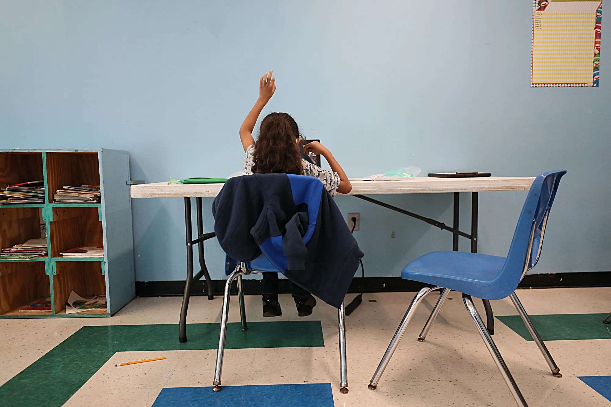 A student raises her hand in her virtual classroom&nbsp;on Sept. 21, 2020. Schools became&nbsp;more susceptible to attacks last year as many schools turned to remote learning.&nbsp;&nbsp;