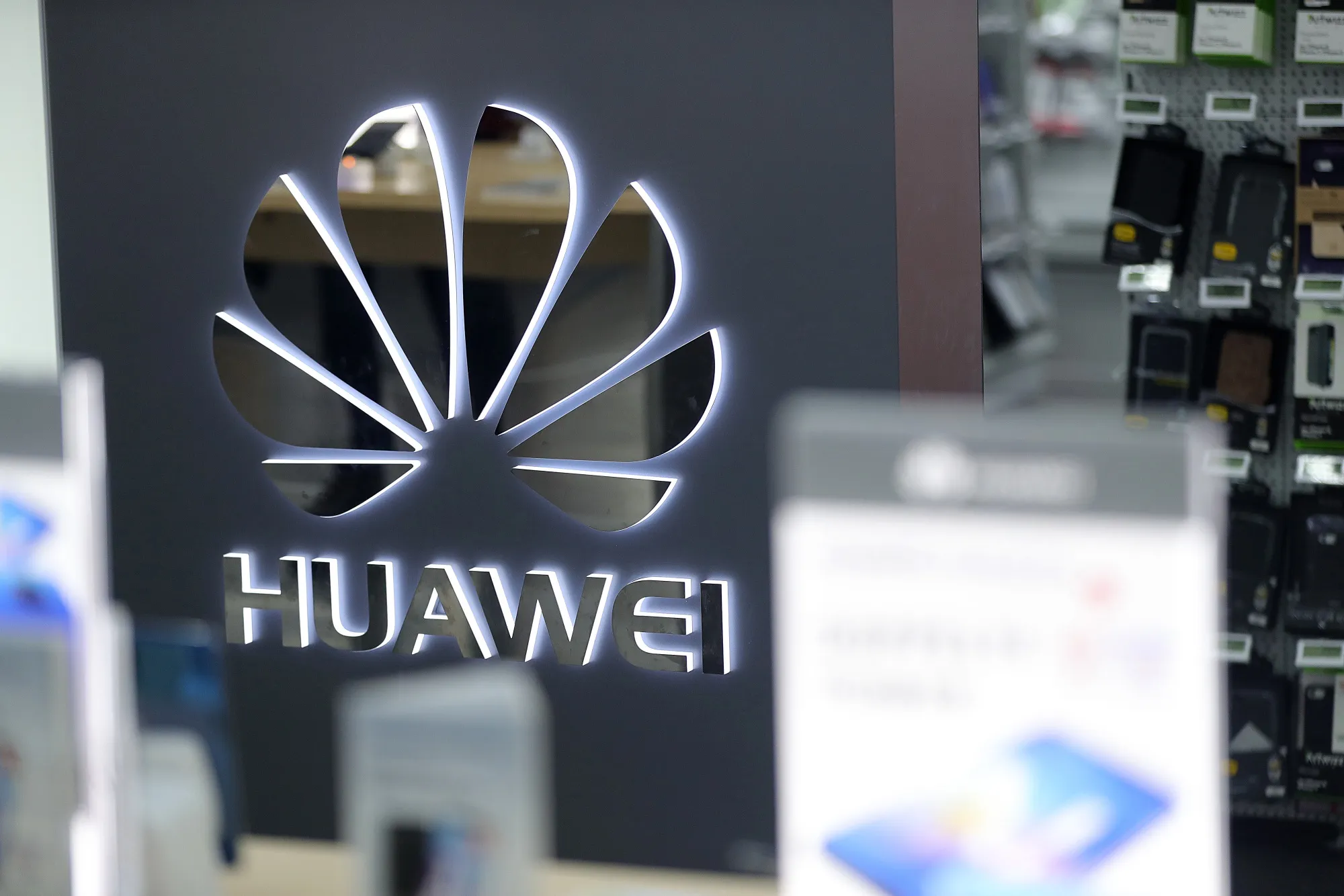 A Huawei Technologies Co. logo sits on display inside an electronic goods store&nbsp;in Berlin.
