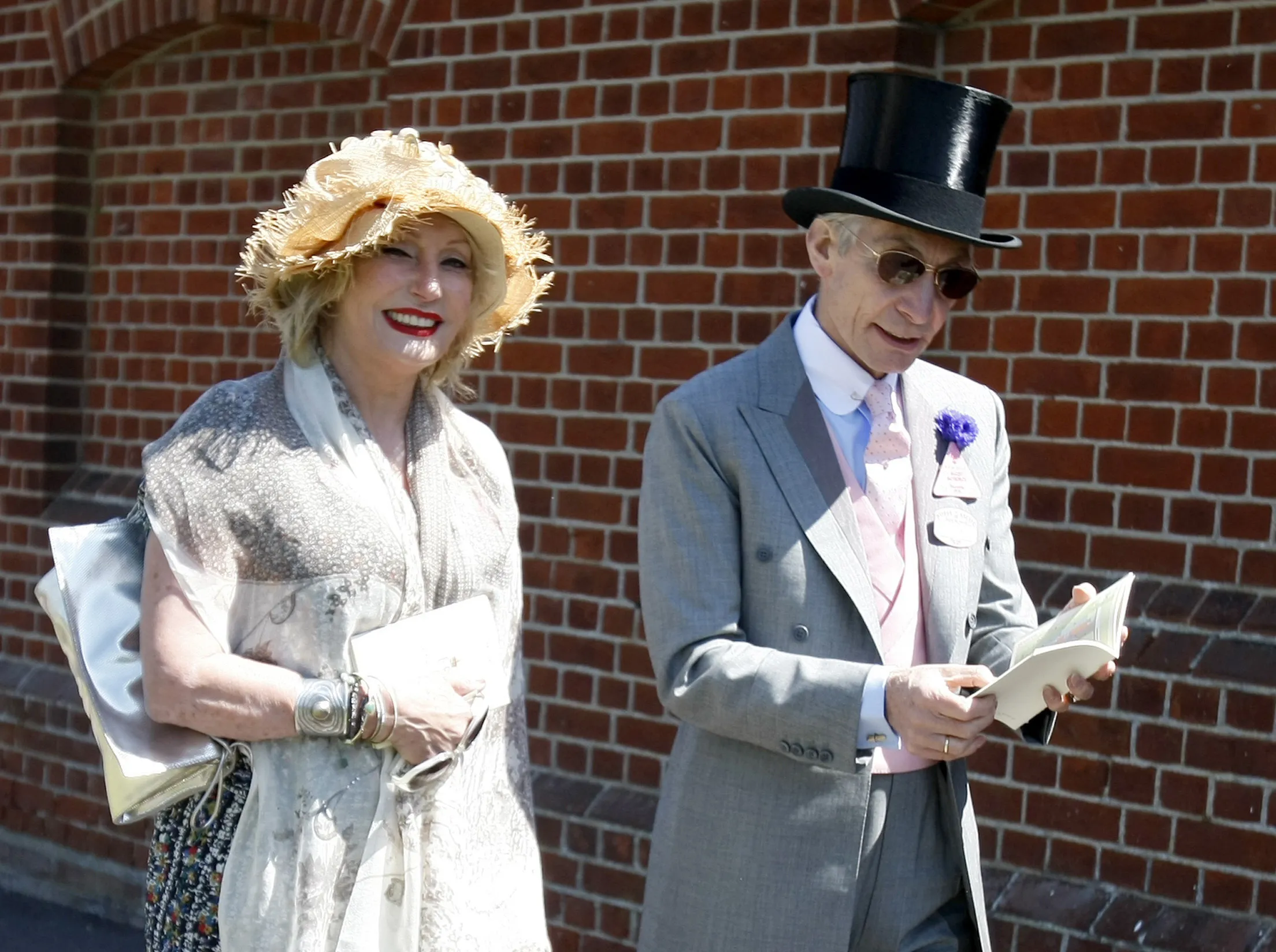 Charlie Watts, the drummer of the Rolling Stones, with his wife Shirley, arrive on the third day of the Royal Ascot horse racing meeting at Ascot, England, Thursday, June, 17, 2010. Shirley Ann Watts, a former art student and prominent breeder of Arabian horses who met drummer Charlie Watts well before he joined the Rolling Stones and with him formed one of rock's most enduring marriages, has died at age 84. "Shirley died peacefully on Friday 16th December in Devon after a short illness surrounded by her family," her family announced Monday, Dec. 19, 2022. (AP Photo/Alastair Grant, File)