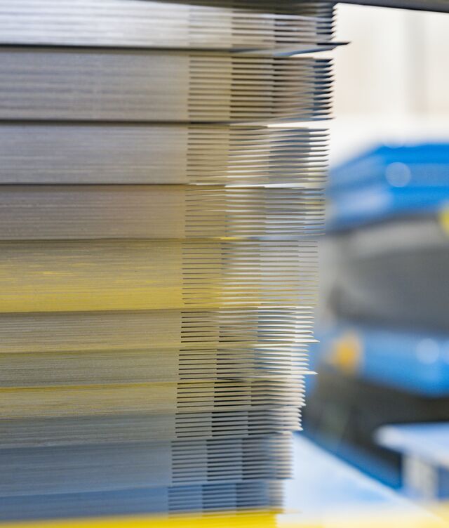 Once assembled, those sheets form the steel core of a transformer.