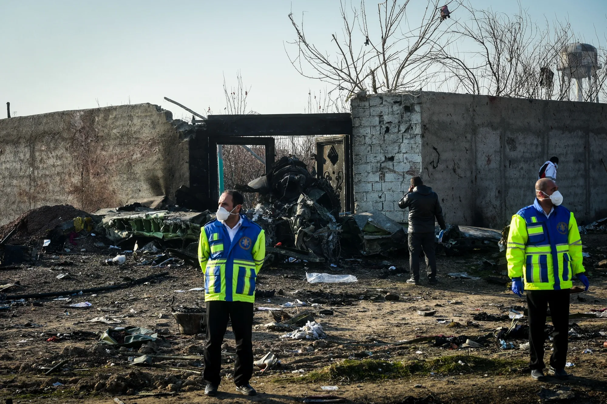 Rescue workers search the wreckage of a Boeing&nbsp;aircraft, operated by Ukraine International Airlines, which crashed shortly after takeoff near Shahedshahr, Iran, on&nbsp;Jan. 8, 2020.&nbsp;