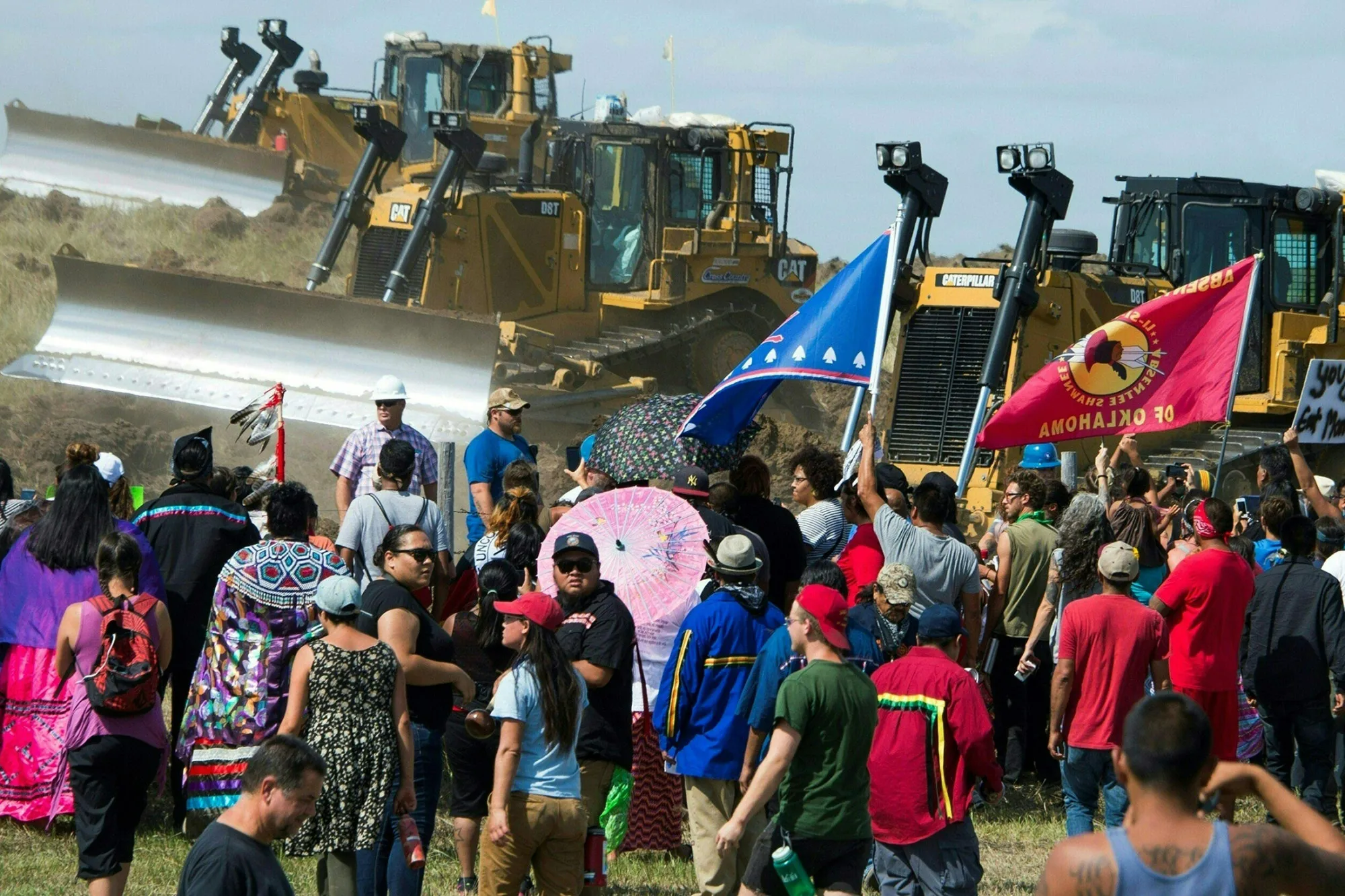 Members of the Standing Rock Sioux Tribe and their supporters opposed to the Dakota Access Pipeline confront bulldozers, Sept. 3, 2016, near Cannon Ball, North Dakota.
