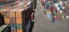 Shipping containers sit stacked in a yard near the Tianjin Port in this aerial photograph taken in Tianjin, China.