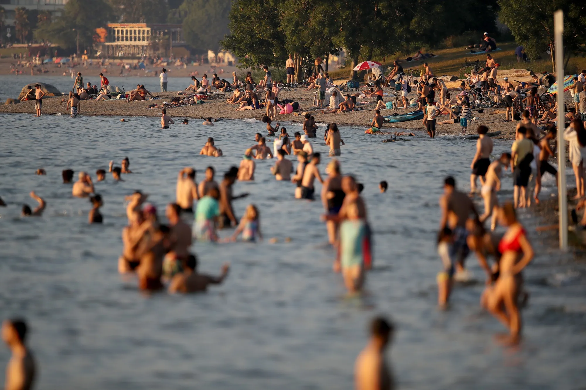 Beachgoers on Kitsilano Beach cool off during this week’s heatwave in Vancouver, British Columbia, Canada,&nbsp;
