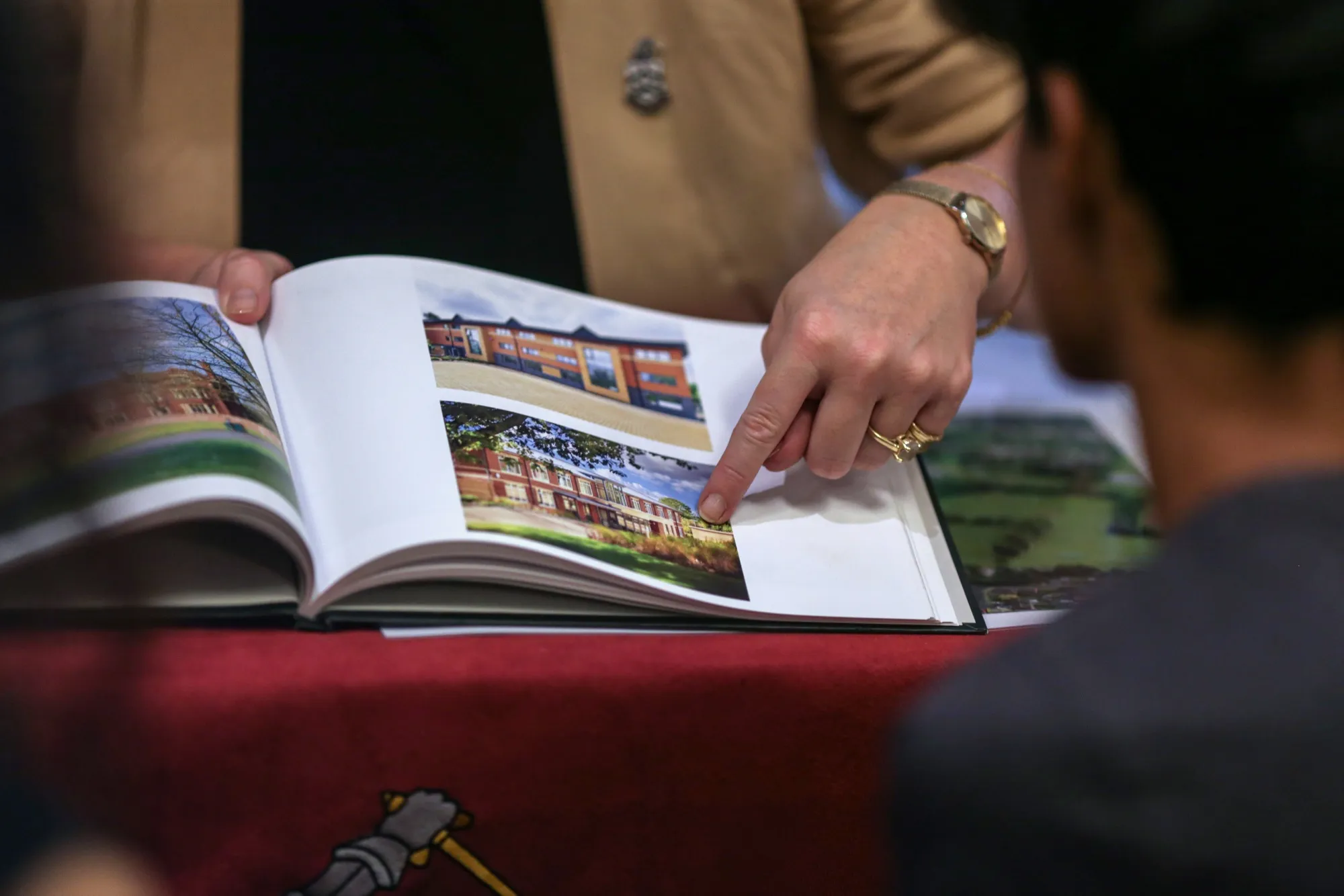 A school representative&nbsp;gives information to a visitor at World Boarding School Fair in Mumbai.