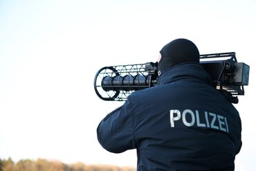 A police officer operates an anti-drone gun during the launch of the German police's new anti-drone unit in Ahrensfelde, on Dec. 2.