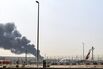 Smoke from an ongoing fire near Dubai International Airport on March 16.