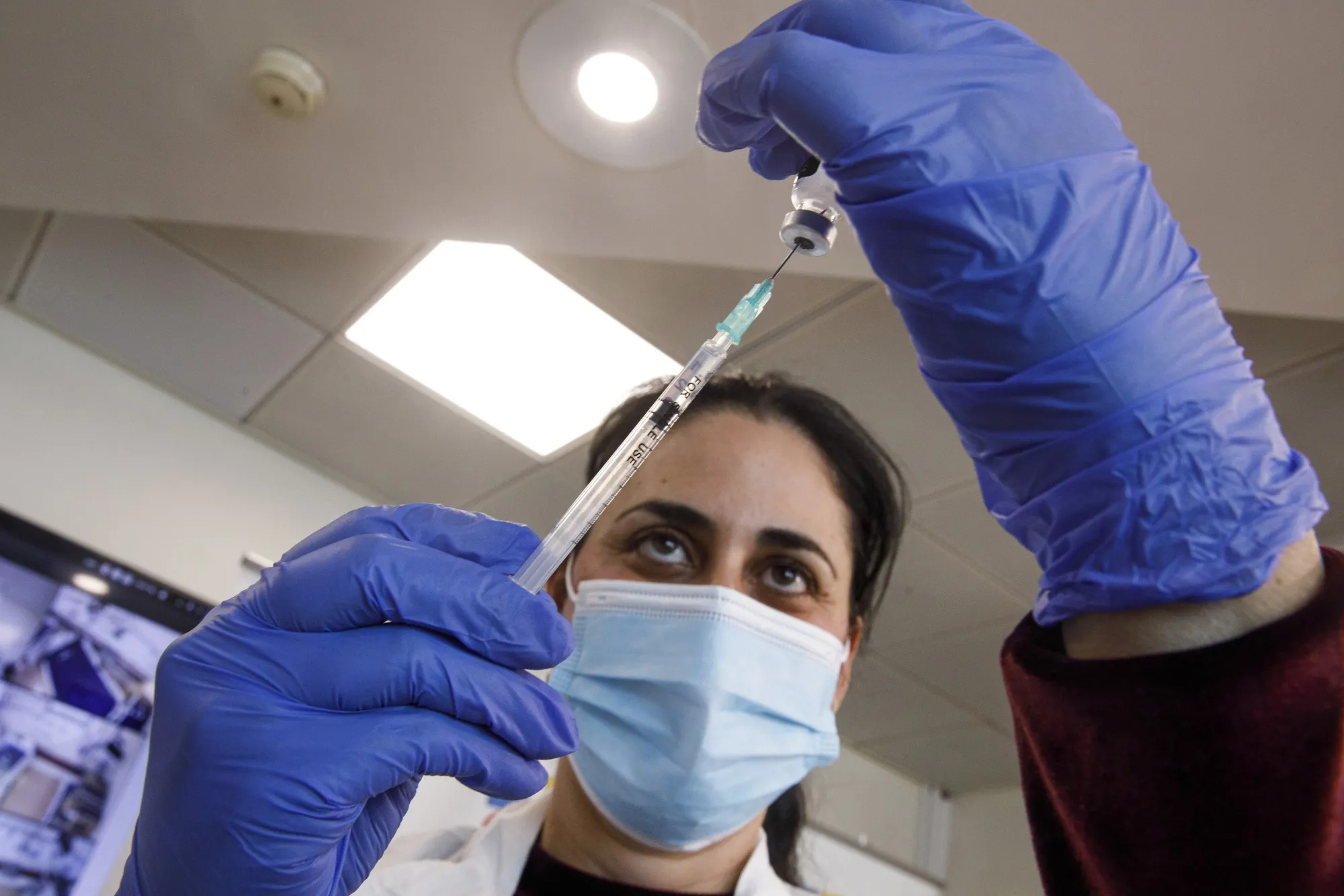 Frontline Medical Workers Receive Pfizer Covid-19 Vaccine