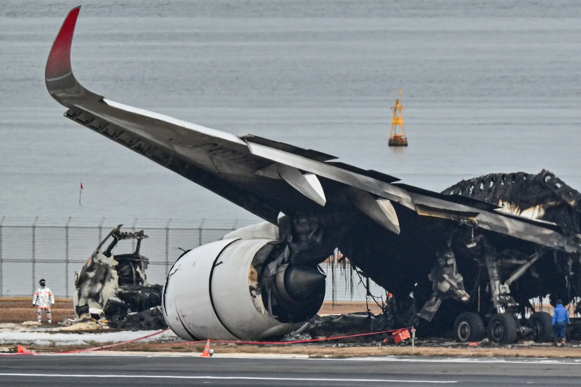 The burnt wreckage of a Japan Airlines plane on the tarmac at Tokyo International Airport on Jan. 3.&nbsp;