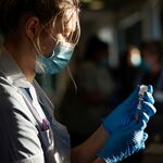ST HELENS, UNITED KINGDOM - A nurse draws the Oxford-AstraZeneca Covid-19 coronavirus vaccine into a hypodermic needle at Totally Wicked Stadium home of St Helen's rugby club. (Photo by Christopher Furlong/Getty Images)