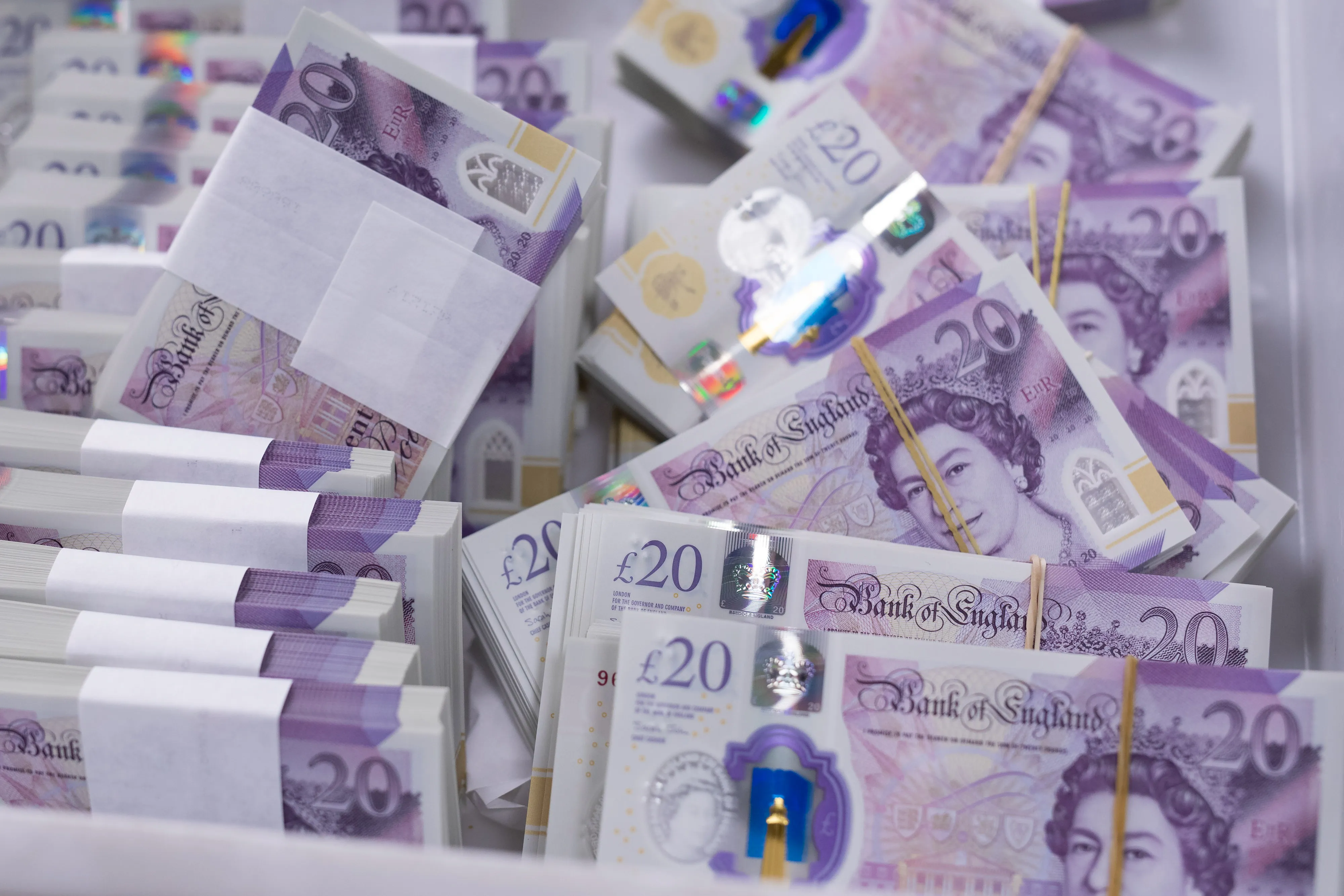 Bundles of new British 20-pound banknotes in London.