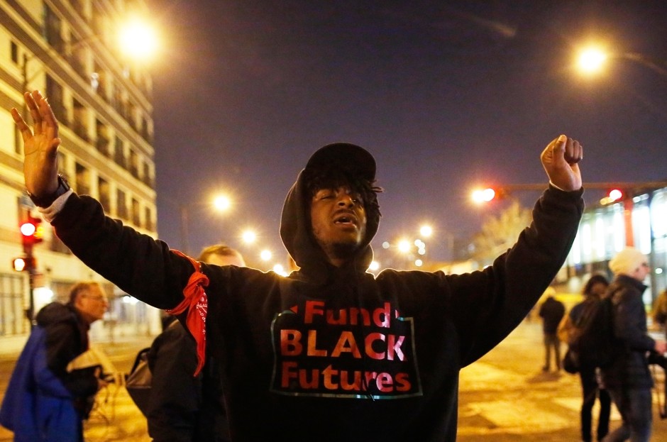 A demonstrator chants as he marches through the streets during protests in Chicago.
