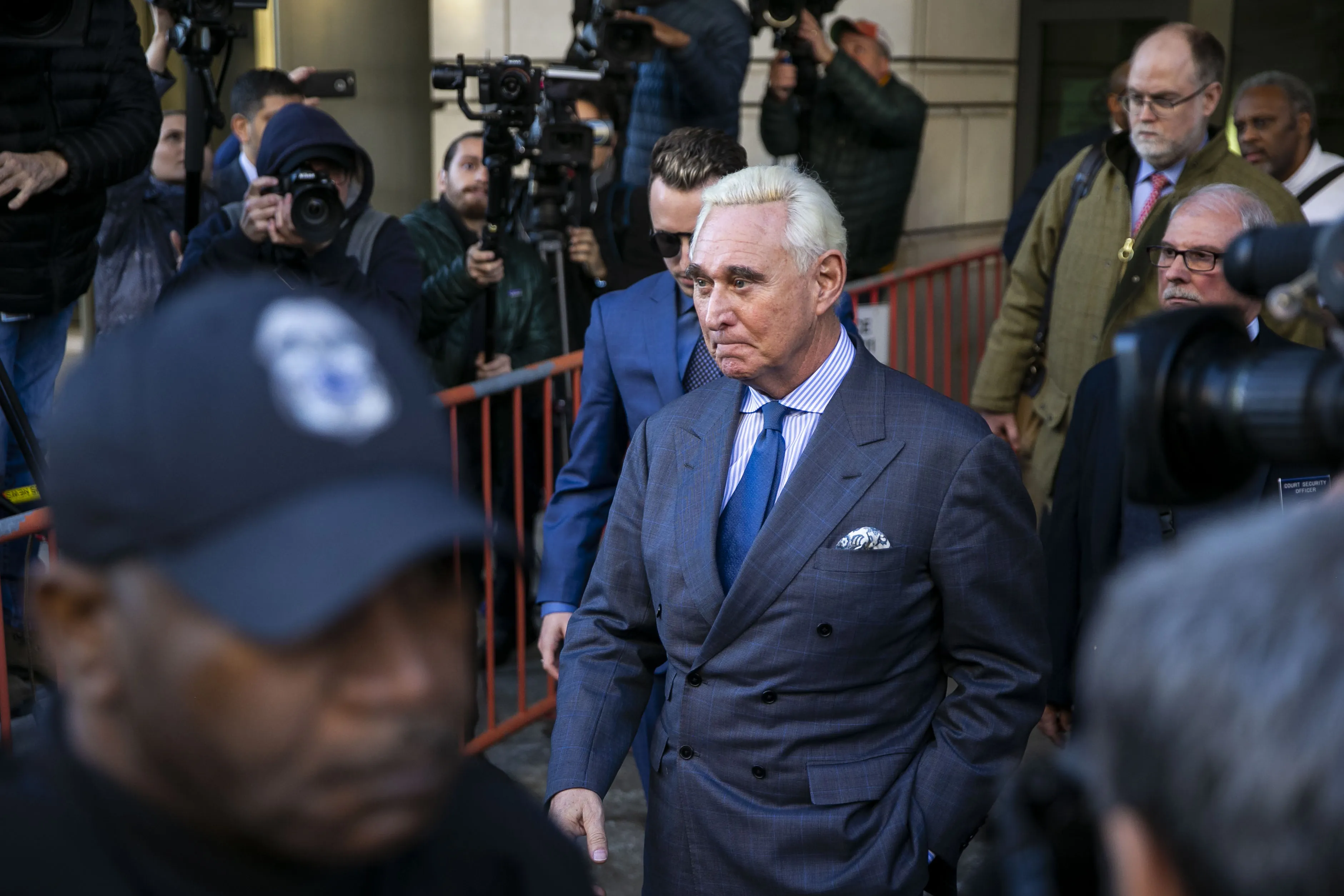 Roger Stone exits federal court in Washington, D.C. on Feb. 21, 2019.