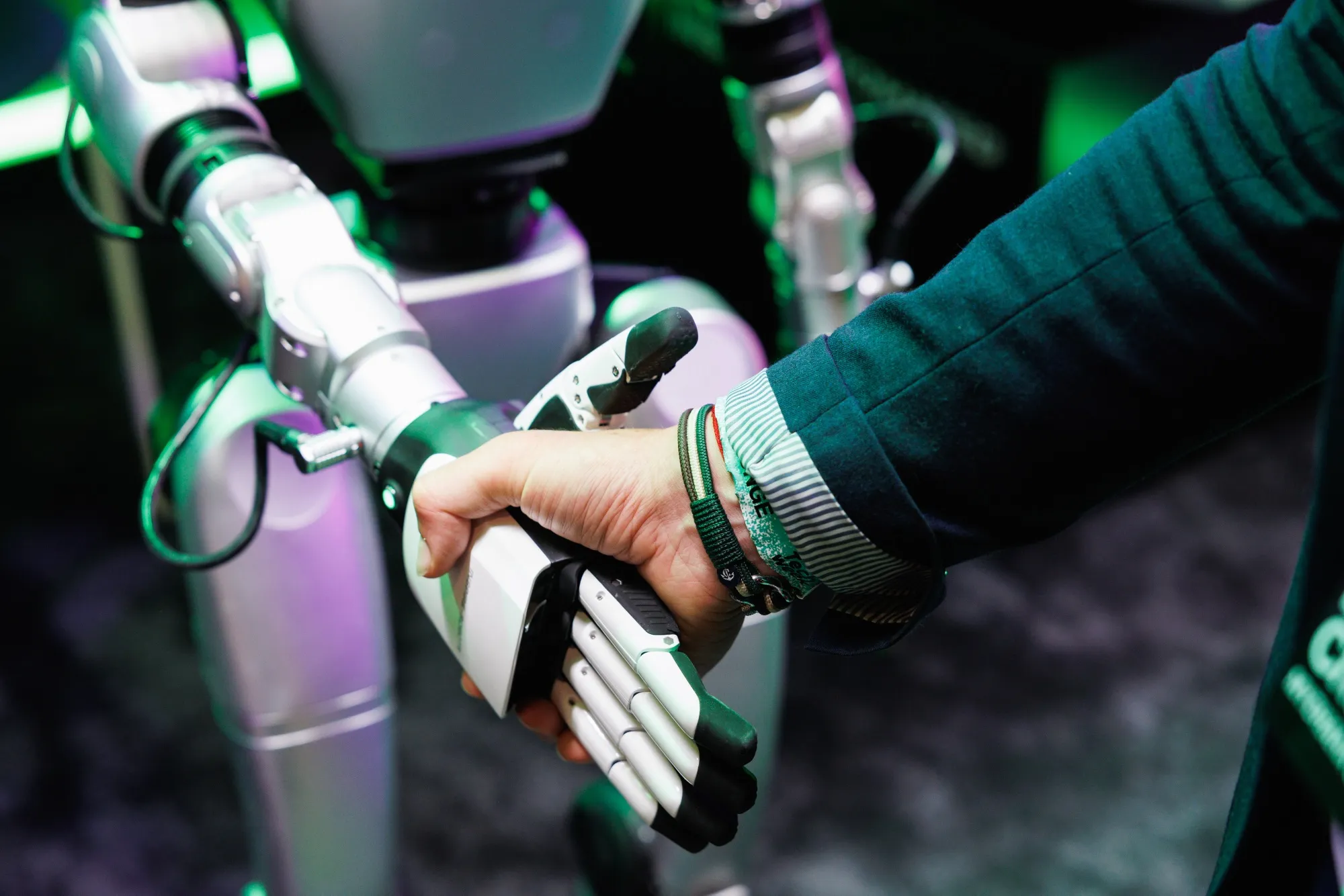 An attendee interacts with a Reply humanoid robot at Italian Tech Week in Turin, Italy, on Friday, Oct. 3, 2025.&nbsp;