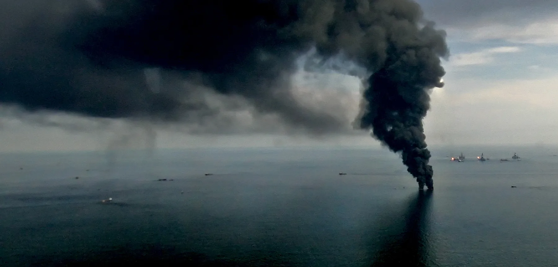 Smoke billows from controlled oil burns near the site of the BP Plc Deep Water Horizon oil spill site in the Gulf of Mexico off the coast of Louisiana, on June 19, 2010.
