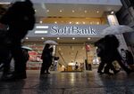 Pedestrians walk past a SoftBank Group Corp. store in Tokyo, Japan.