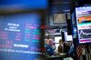 A trader works on the floor of the New York Stock Exchange (NYSE) in New York, U.S., on Friday, Nov. 16, 2018. U.S. equity indexes fluctuated as energy and utility gains were offset by a plunge in retail and technology stocks.