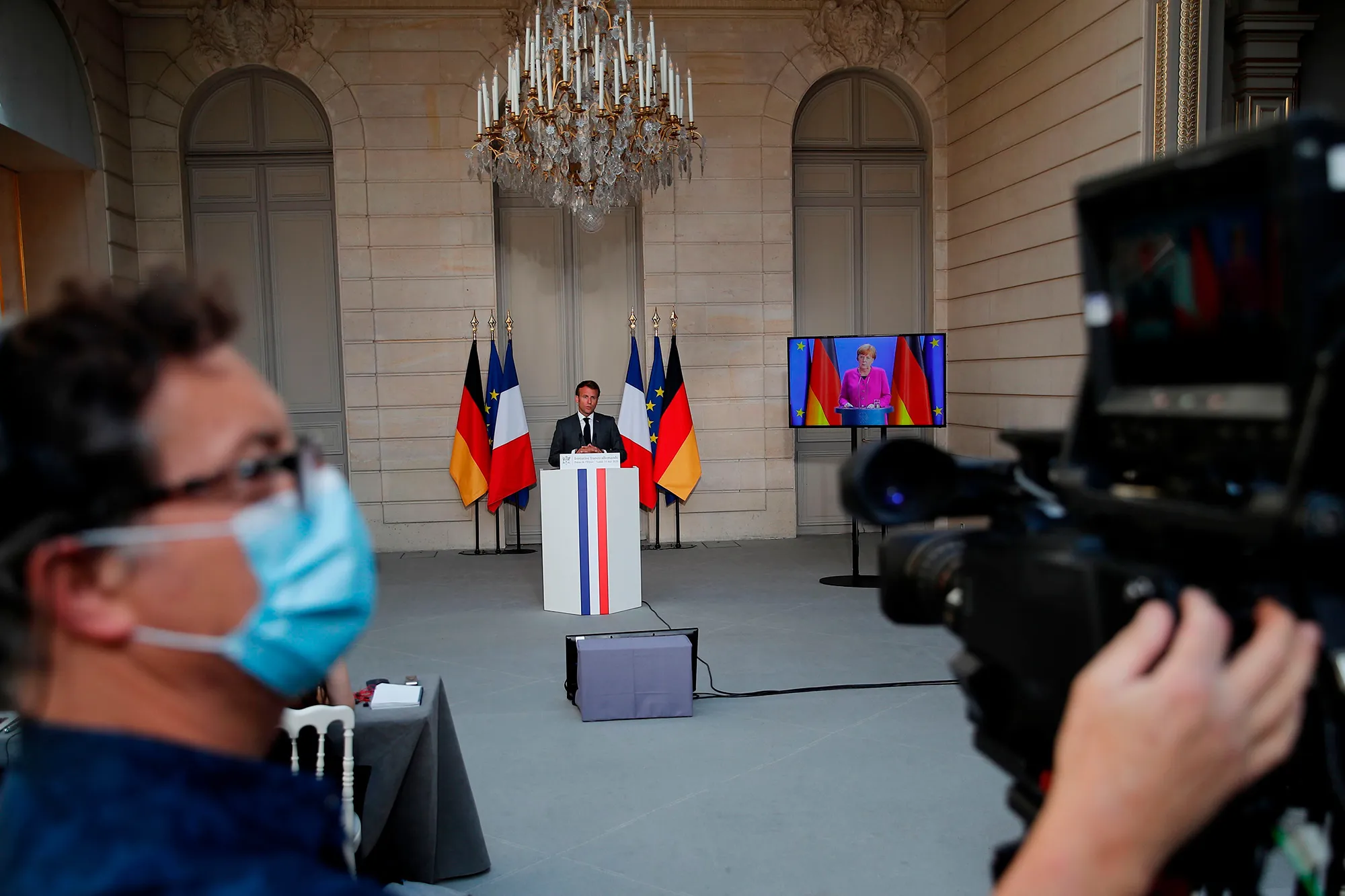 Emmanuel Macron speaks during a joint video news conference with Angela Merkel, in Paris, on May 18.