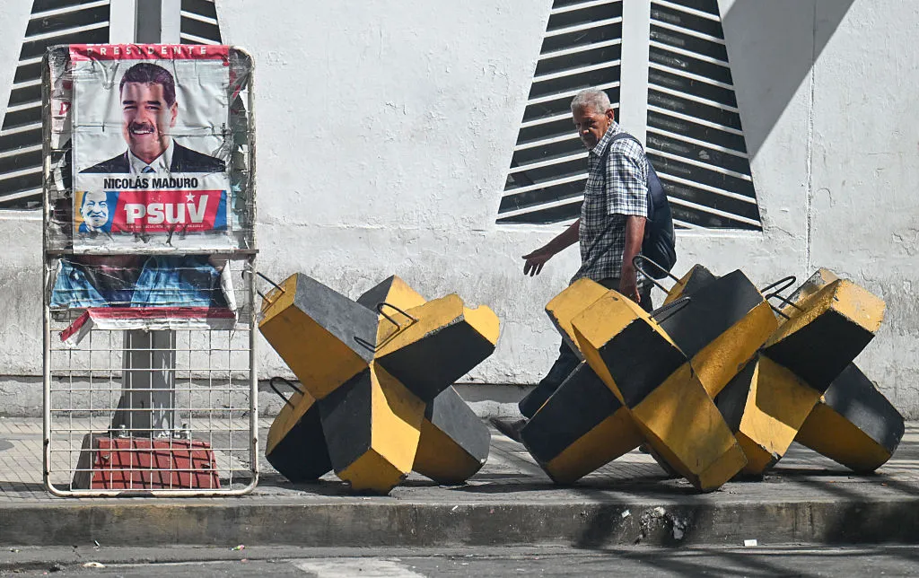 A poster of Nicolas Maduro and an anti-tank barricade in Caracas, on Oct.&nbsp;28.