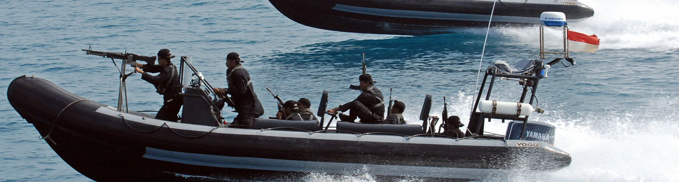 JAKARTA, INDONESIA: Indonesian marines anti-terror troops sail speed boats during the simulation of the interception of a pirate ship as part of joint exercises with the US navy seals, off the Sepa island, northern Jakarta, 27 July 2006. The exercise is aimed at increasing knowledge, technical and tactical capacity of Indonesian troops when carrying out maritime counter terrorism operations. AFP PHOTO/Bay ISMOYO (Photo credit should read BAY ISMOYO/AFP/Getty Images)
