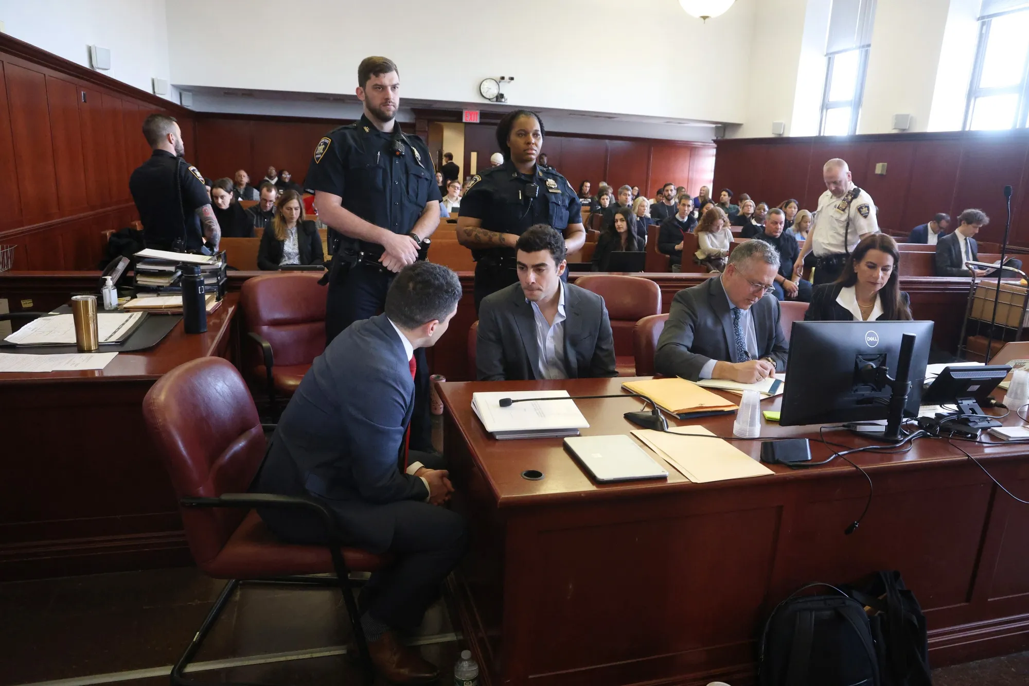 Luigi Mangione, center, during a pretrial hearing at New York State Supreme Court on Dec. 11.