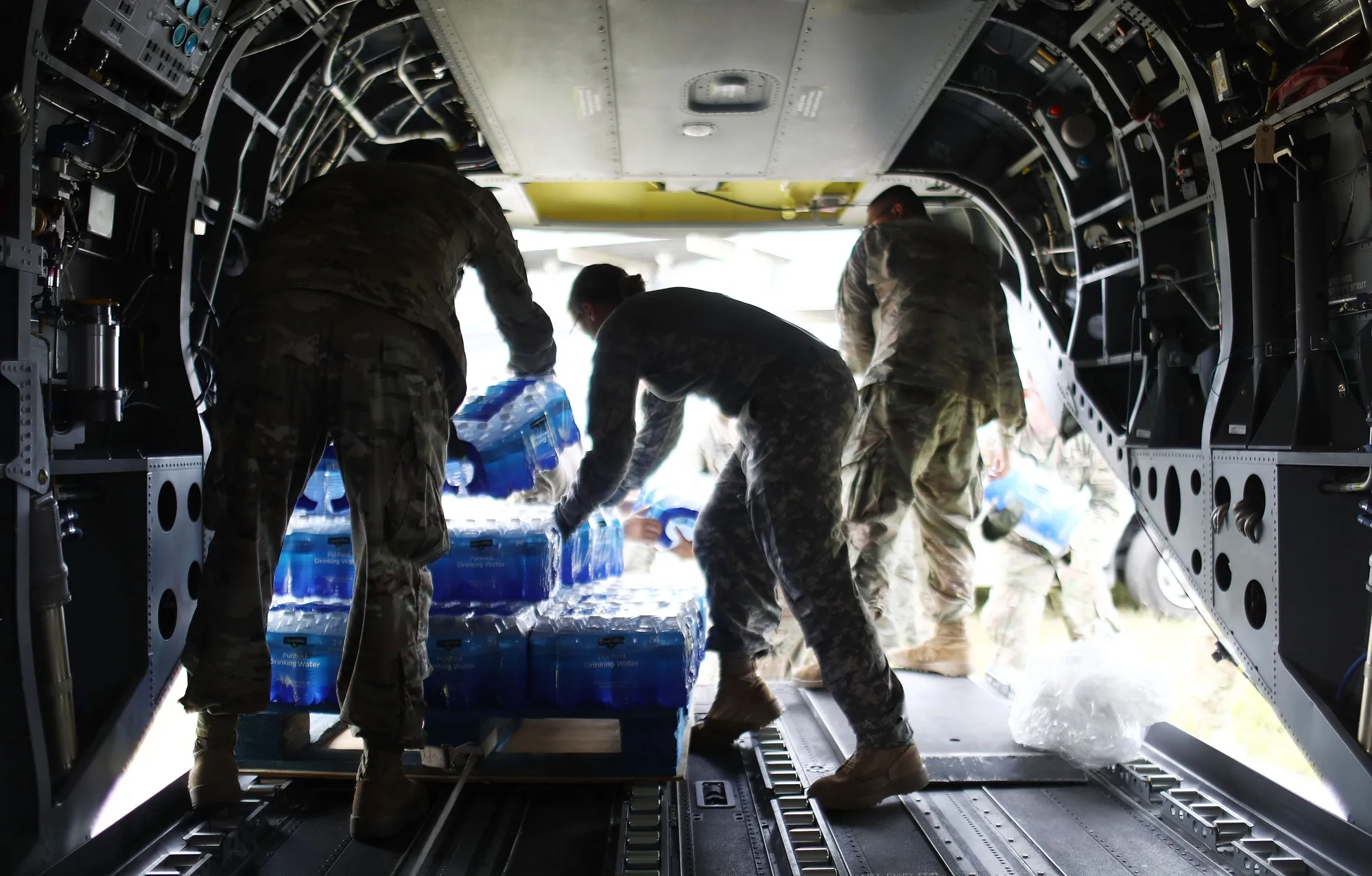 US Army soldiers offload food and water provided by FEMA from a helicopter during recovery efforts after Hurricane Maria in Utuado, Puerto Rico, in 2017.