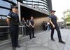 Police officers stand guard a building where the Japanese embassy is located in Seoul.