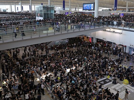 Hong Kong Cancels All Remaining Monday Flights as Protesters Swarm Airport