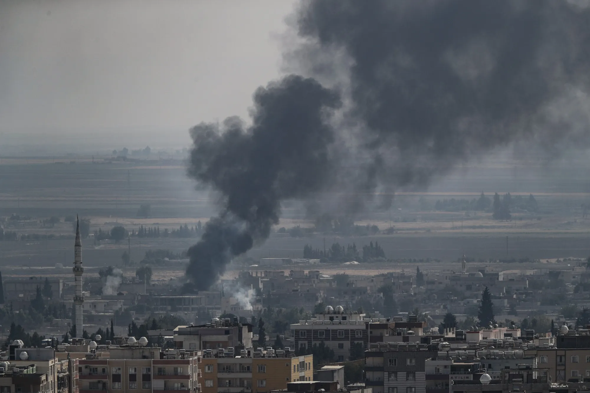 Smoke rises over Ras al-Ain, Syria, on Oct. 17.