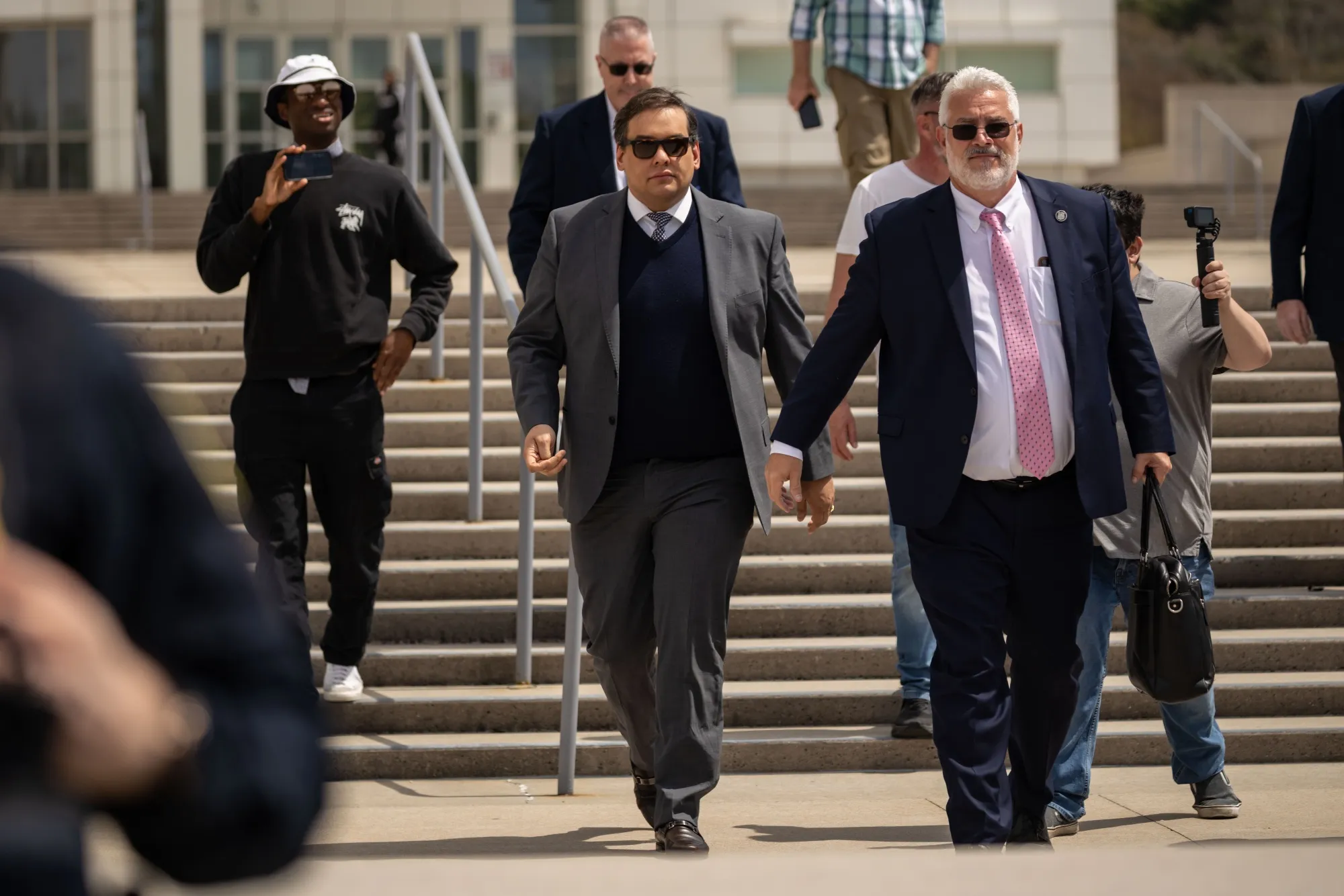 George Santos exits federal court in Central Islip, New York, on&nbsp;April 25.