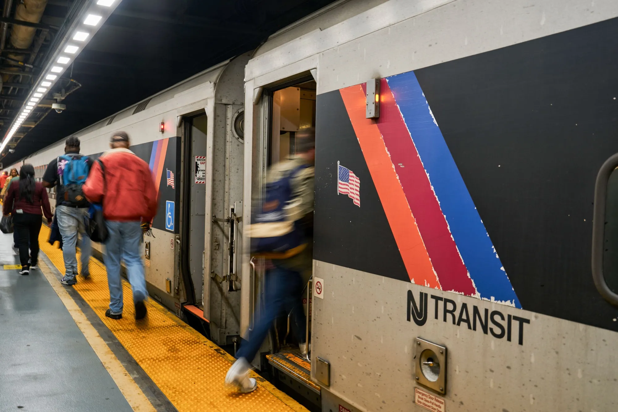 Commuters board a New Jersey Transit train at Penn Station in New York&nbsp;on May 5.&nbsp;
