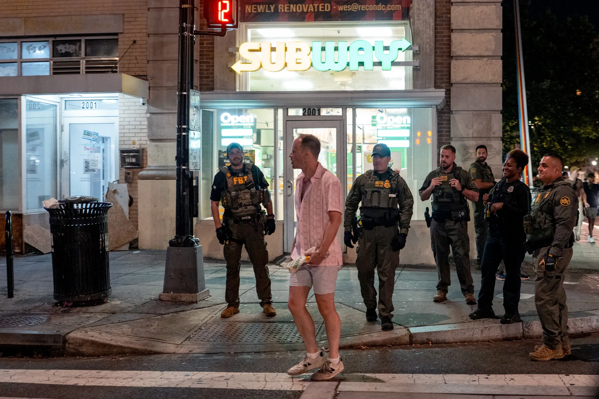 FBI and Border Patrol officers speak with Sean Charles Dunn in Washington in August.
