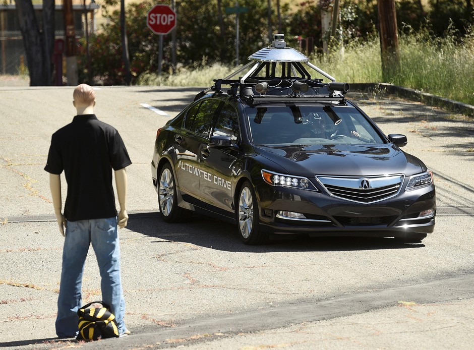 An autonomous Acura avoids mowing down around a dummy at Honda's testing grounds in California.
