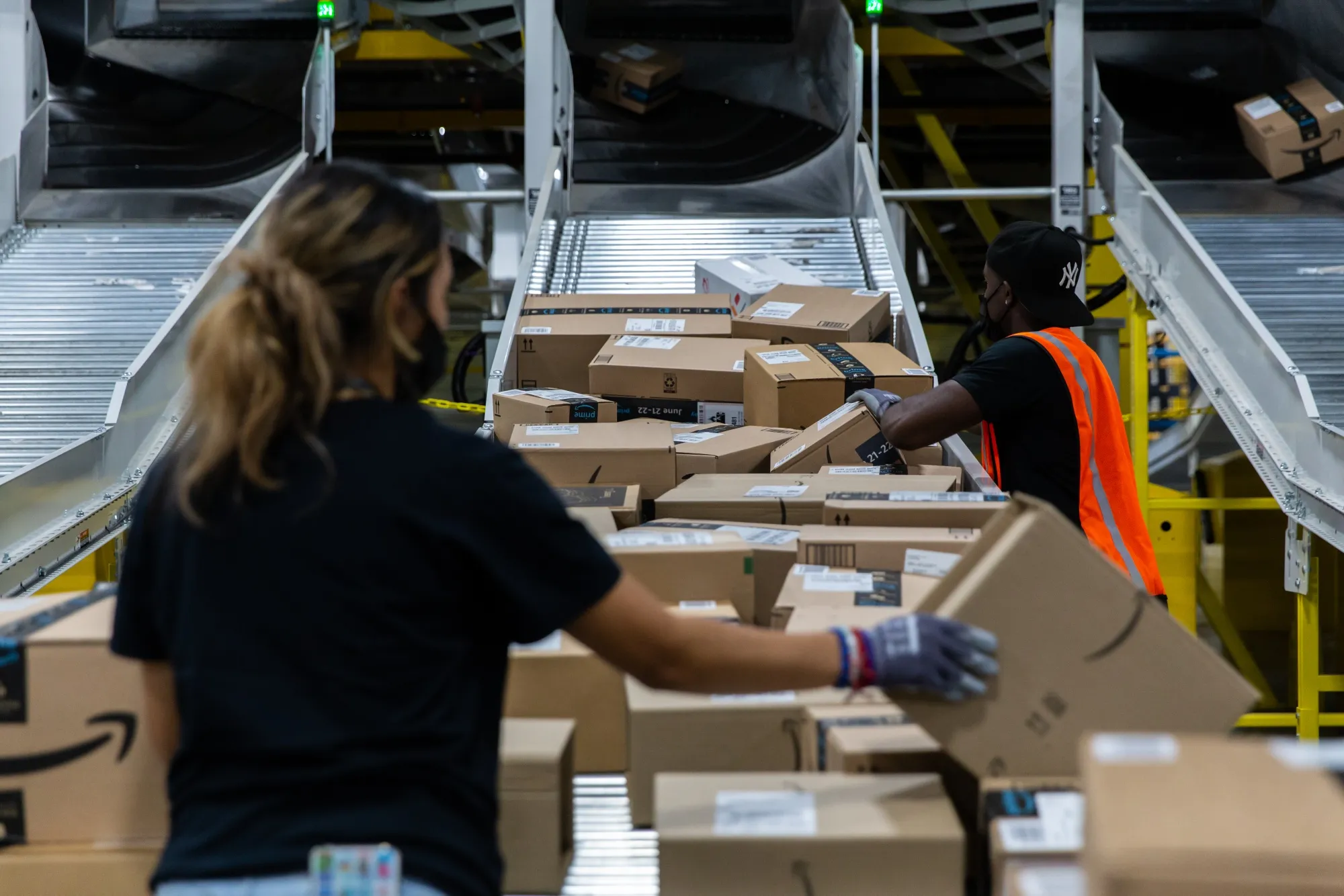 Workers retrieve boxes at an Amazon fulfillment center on Prime Day in Raleigh, North Carolina, on&nbsp;June 21.&nbsp;