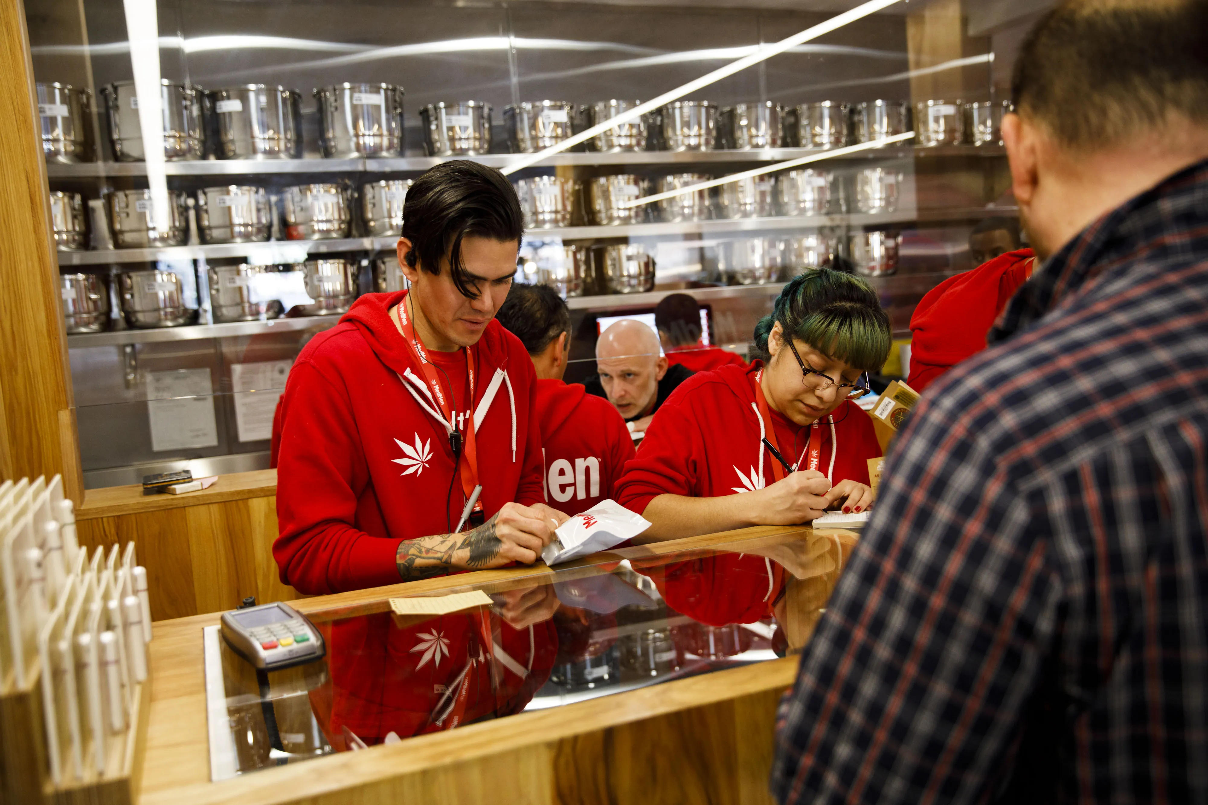 Employee assist customers at a dispensary in West Hollywood.