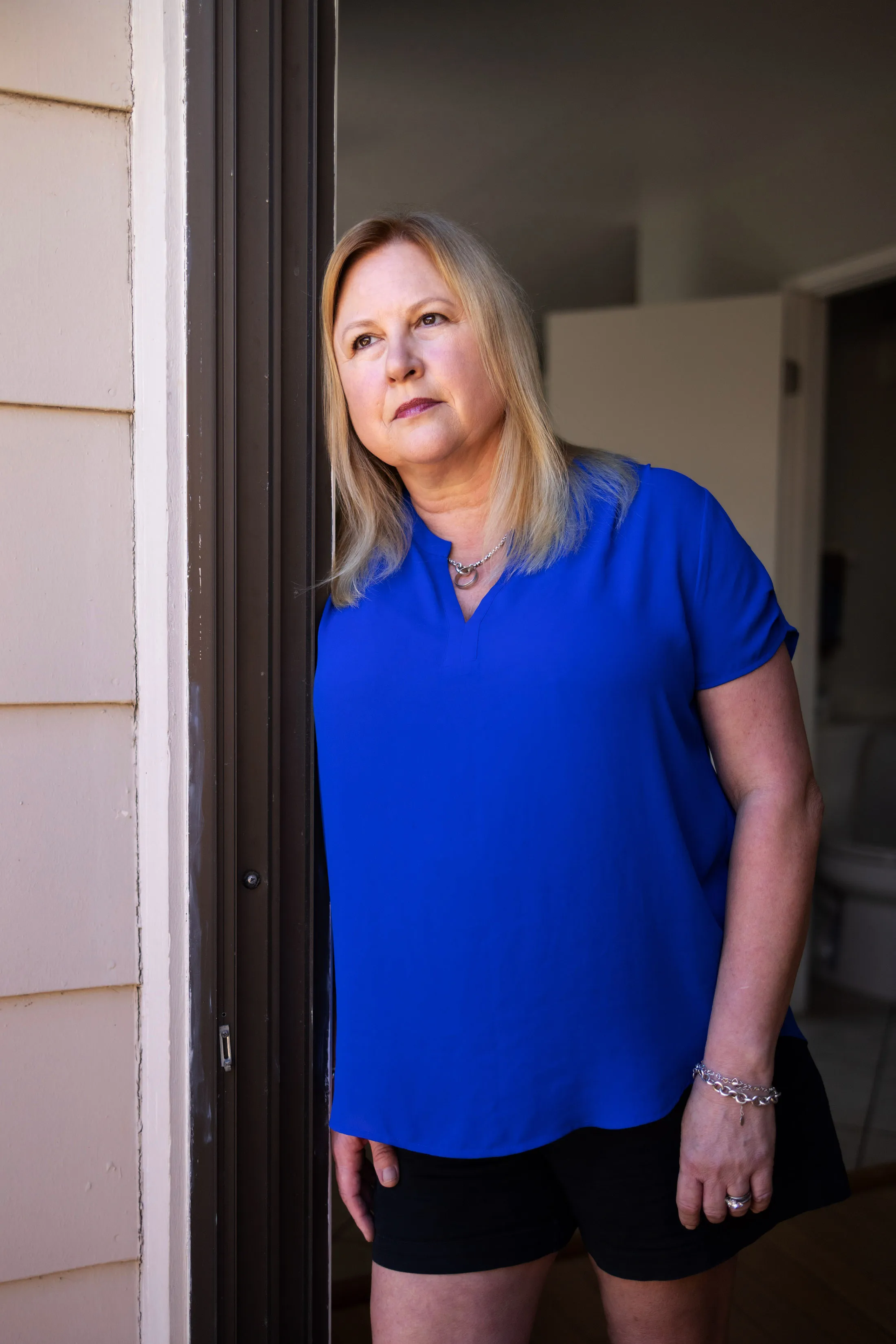 Jenny Nappo stands in the door of her home
