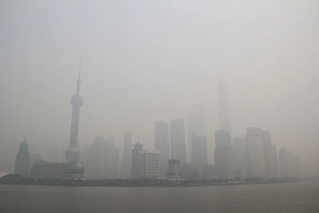 The Lujiazui Financial District in Pudong in smog in Shanghai, China, in December 2013.

