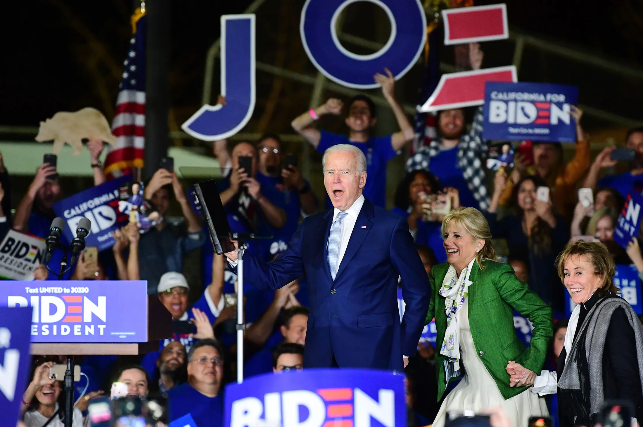 Democratic presidential hopeful and former Vice President Joe Biden arrives onstage with his wife, Jill, and sister, Valerie (right), for a Super Tuesday event in Los Angeles on March 3.