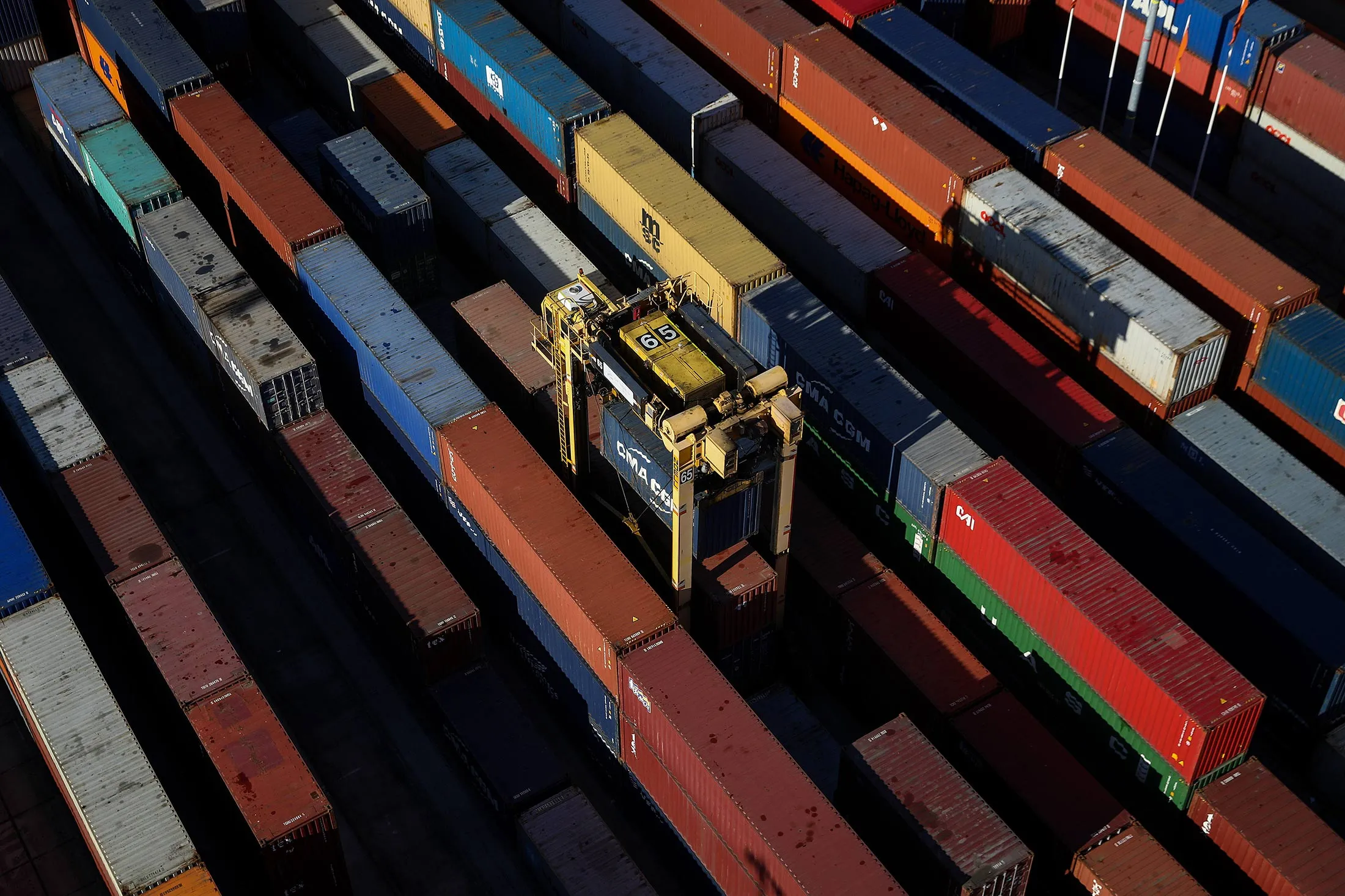 A straddle carrier moves shipping containers around the dockside at the container terminal operated by DP World Ltd., at the Port of Southampton, in Southampton, U.K., on Wednesday, Nov. 2, 2016.
