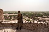 A soldier on the ramparts of  Derawar Fort looking out over the Cholistan desert.
