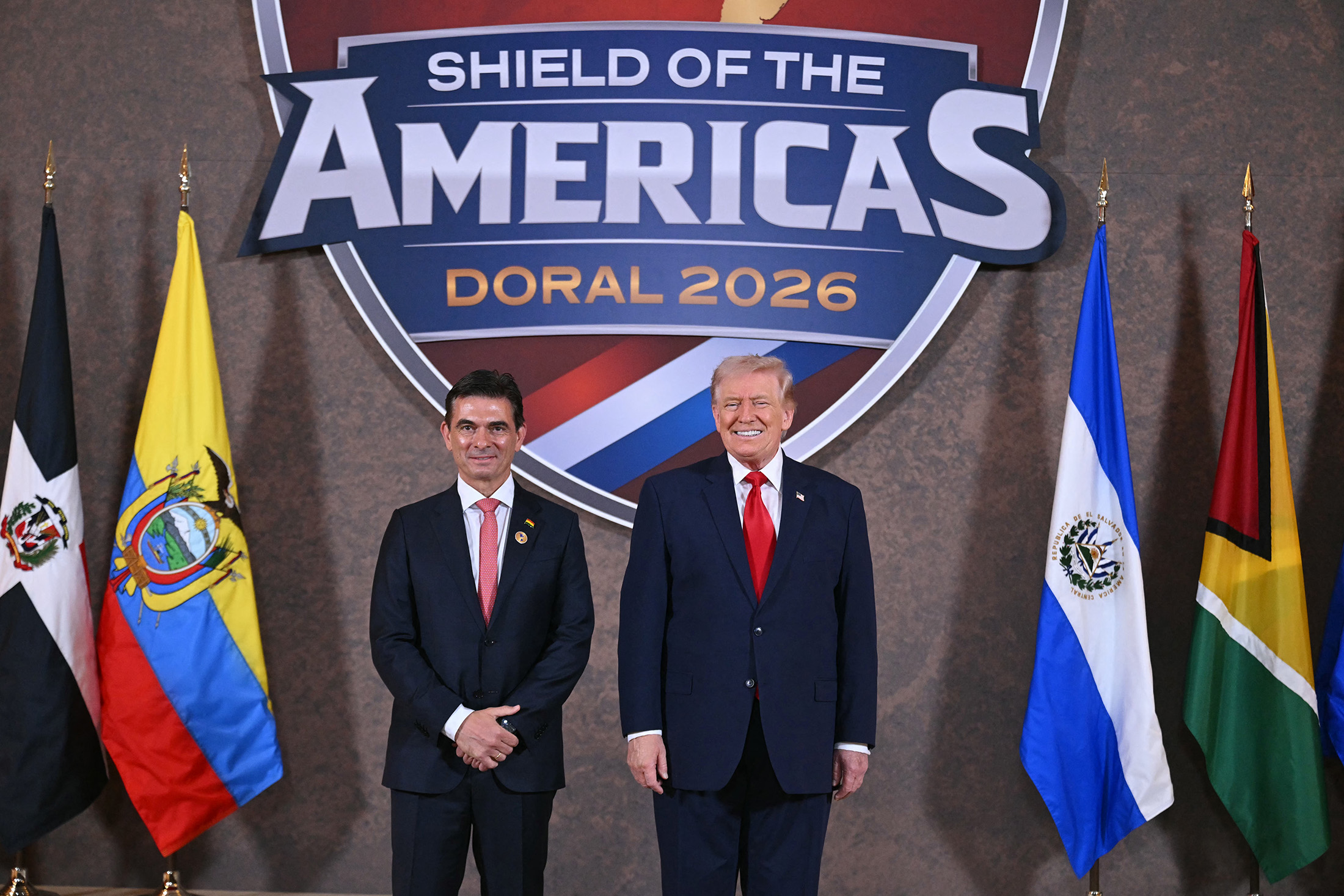 US President Donald Trump and Bolivia's President Rodrigo Paz Pereira pose for a photo at the beginning of the "Shield of the Americas" Summit at Trump National Doral in Miami, Florida, March 7, 2026. Photographer: Saul Loeb/AFP/Getty Images