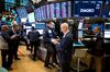 Traders work on the floor of the New York Stock Exchange (NYSE) in New York, U.S., on Friday, Nov. 9, 2018. U.S. stocks slumped as investors considered what a tumble in oil prices means for the economy, while a fresh batch of weak tech earnings weighed on the high-flying sector.