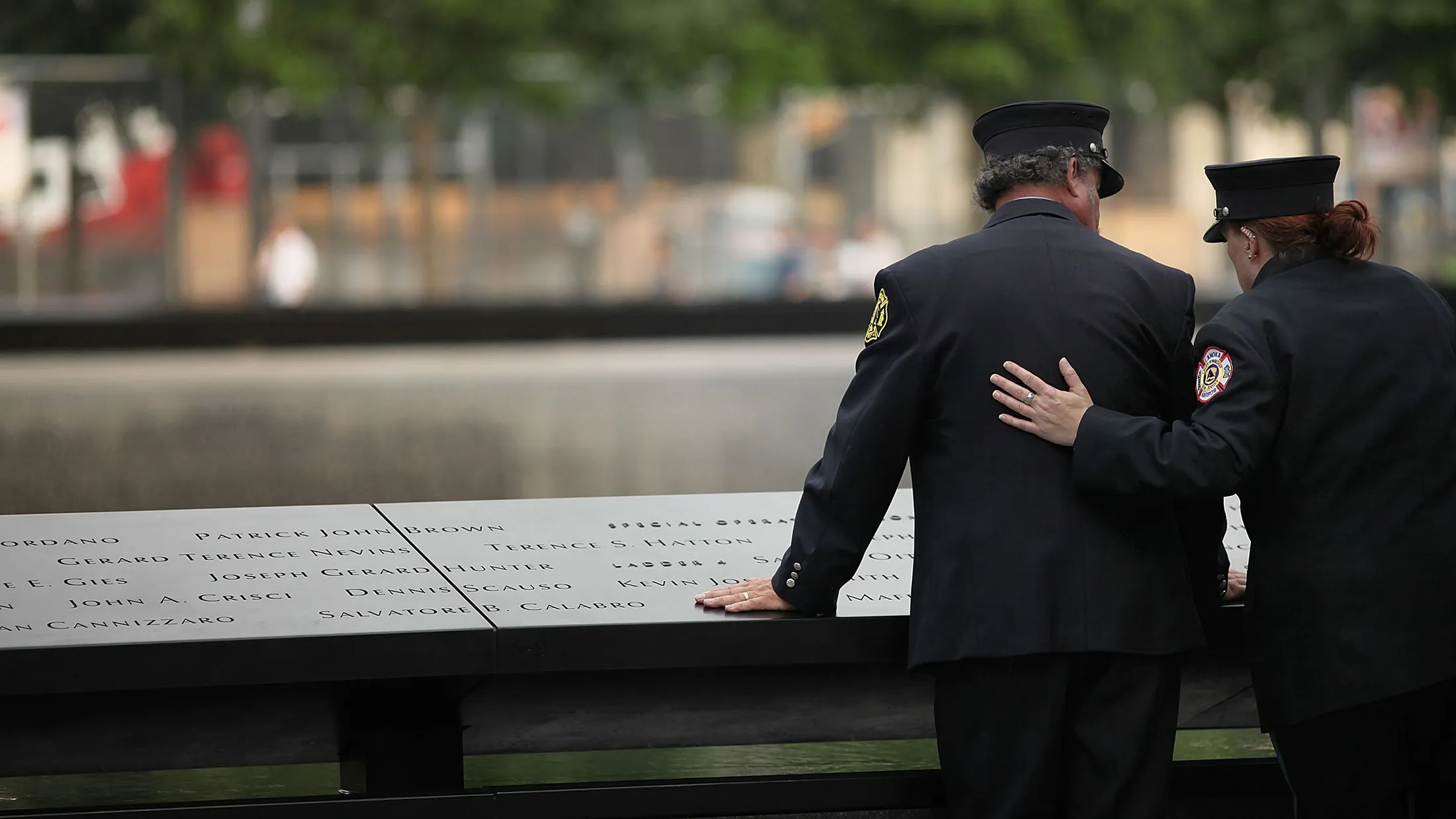 NEW YORK, NY - MAY 30: A firefighter pauses during a tribute at the 9/11 Memorial for recovery workers and first responders on the10-year anniversary of the formal end of cleanup operations at Ground Zero on May 30, 2012 in New York City. Thousands of men and women came to Ground Zero following the September 11, 2001 terrorist attacks to help with the recovery effort. Numerous first responders, including police and fire fighters, have subsequently been plagued with health issues many believe are related to the air they breathed in the weeks and months following the attacks. The nine-month recovery effort at the site ended May 30, 2002.
