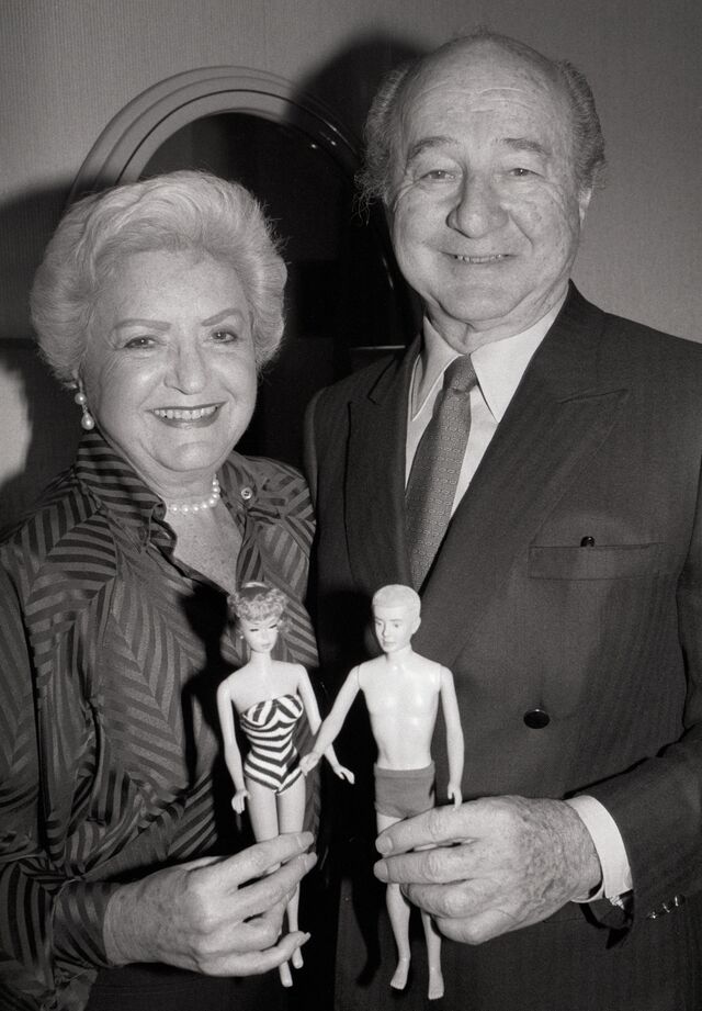 Ruth and Elliot Handler holding Barbie and Ken dolls in 1987.